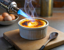 Caramelized creme brulee with a kitchen blowtorch