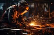 © sirisakboakaew - Machine operators skillfully operate steel forming machinery, making cylinder-rolled steel