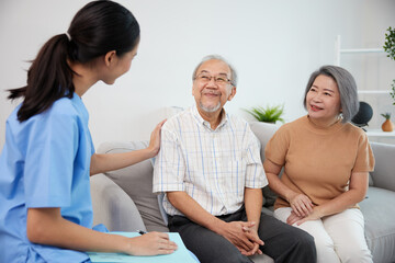 Wall Mural - nurse or caregiver meeting and talking with about health with senior couple