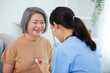 © offsuperphoto - nurse or caregiver using stethoscope to examine senior woman at home