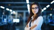 Beautiful young woman scientist in white coat and glasses