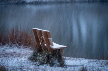 Bench On A Snowy Lake