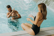 © BGStock72 - Young couple having fun in the indoor swimming pool