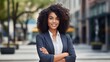 Young happy pretty smiling professional business black woman, happy confident positive female entrepreneur standing outdoor on street arms crossed, looking at camera generative ai