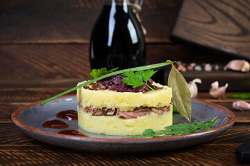 Wall Mural - Mashed potato with beef, caramelized onion and cherry sauce