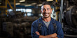 Smiling Young Factory Worker in Blue Overalls at Industrial Workshop