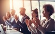 © piai - Group of people applauding together in business meeting