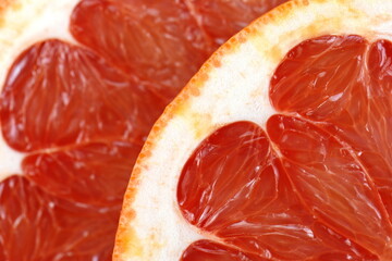 Wall Mural - Juicy red grapefruit macro image. Macro red grapefruit texture background.