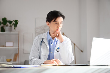 Poster - Female doctor video chatting with patient in office