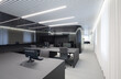 © ADDICTIVE STOCK - Ambient-lit modern office with gray workstations