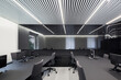 © ADDICTIVE STOCK - Modern office with linear ceiling lighting