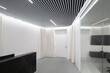© ADDICTIVE STOCK - Modern reception area with striped ceiling