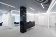 © ADDICTIVE STOCK - Spacious office with translucent partition and striped ceiling