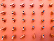Horizontal photography of a bunch of CCTV cameras pointing in all directions mounted on an orange wall. 