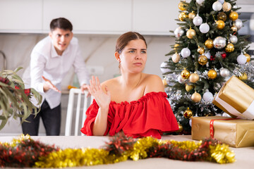 Wall Mural - Quarrel of wife and husband at the Christmas celebration in home