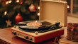 A vintage record player with a Christmas vinyl album.