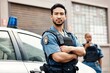 © M Einero/peopleimages.com - Asian man, police and arms crossed in city for law enforcement, protection or street safety. Portrait of serious male person, security guard or cop ready for justice or crime on patrol in urban town