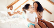 © Anela/peopleimages.com - Family, playing and fun in a bedroom with hand, games and bonding in their home together. Love, relax and children with parent on a bed with secret, gossip or surprise on the weekend in a house