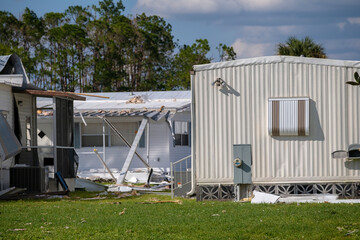 Wall Mural - Property damage from strong hurricane winds. Mobile homes in Florida residential area with destroyed rooftops. Consequences of natural disaster