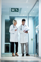 Poster - Tablet, collaboration and doctors talking planning a surgery in a modern hospital in discussion of diagnosis together. Man, woman and healthcare professionals brainstorming at a clinic using internet