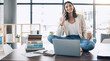 © Rene L/peopleimages.com - Employee, laptop or phone call and sitting on desk in relax startup, marketing company or advertising business. Smile, happy or talking woman on mobile communication technology, laptop or books study