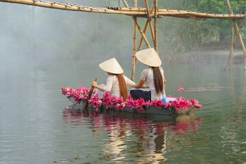 Wall Mural - Boat decorating with waterlily flowers on Yen stream, Ninh Binh, Vietnam