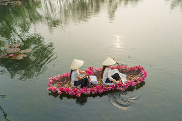 Wall Mural - Boat decorating with waterlily flowers on Yen stream, Ninh Binh, Vietnam