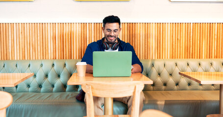 Poster - Happy man in cafe, typing on laptop and remote work, reading email or writing blog, article or search on tech. Computer, freelancer and editor in coffee shop, store or restaurant for project at table