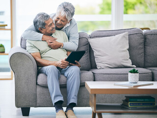 Poster - Tablet, couple and hug on sofa in home living room for love, care and quality time. Senior man, happy woman and embrace with digital technology for online shopping, social media and scroll internet