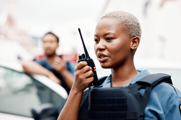 Poster - Black woman, police and walkie talkie for radio in city communication, reinforcement or emergency. African female person, security guard or cop calling backup for crime on patrol in urban town street