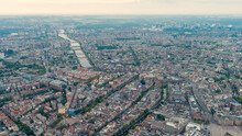 Amsterdam, Netherlands. Panorama Of The City In The Morning In Cloudy Weather. View Of The Amstel River With Locks, Aerial View