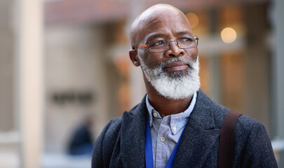 Wall Mural - Senior black man, business and thinking in city, street or town with company goals. Ideas, planning and face glasses of elderly male entrepreneur with vision, mission and success mindset in outdoors.