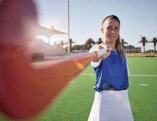 Poster - Woman hockey player, closeup and portrait on field with smile, hockey stick and happy in sunshine. Hockey, outdoor and sport girl at training, exercise and workout in sports ground, arena or stadium