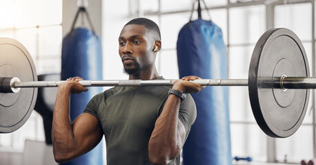 Sticker - Earphones, barbell and black man training in gym while listening to music, radio or podcast. Energy, health and male bodybuilder from South Africa weight lifting while streaming audio or sound track.