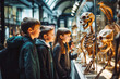 Curious group of primary school students observing animal skeletons and skulls at the museum, fun and educational school field trip