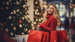 Smiling woman with Christmas gifts in shopping bags at the mall. Christmas sale concept