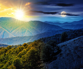 Wall Mural - mountainous autumn landscape with sun and moon at twilight. beech forest on the hillside. day and ni