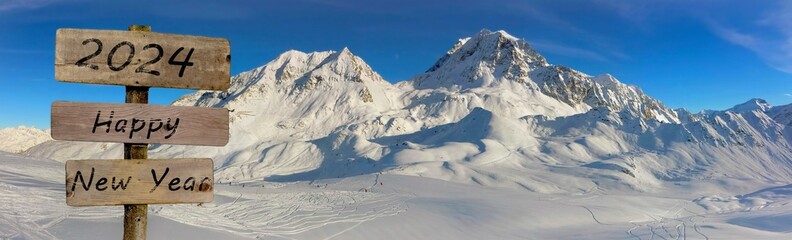 Wall Mural - wooden sign and panoramic view on peak mountain covered with snow