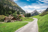 Fototapeta Tęcza - Rustic village in Alpstein mountain range between trail to Seealpsee lake during summer at Appenzell, Switzerland