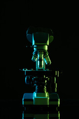 Poster - Vertical image of laboratory microscope and copy space on black background