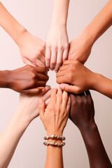 diverse hands coming together to form a circle