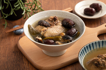 Wall Mural - Delicious Taiwanese peeled green chili pepper chicken soup with mushroom