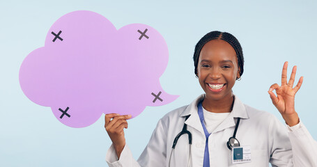 Sticker - Happy black woman, doctor and OK sign with speech bubble for social media review against a studio background. Portrait of African female person, surgeon or nurse showing icon, okay or emoji on mockup