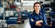 Smiling young  car mechanic woman posing with arm crossed  in auto repair shop, mechanic woman happy working in car garage, 