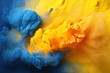 Blue and yellow pigment clouds joining together. 