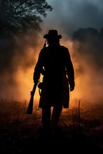 Soldier Silhouette From The Civil War Era Period. Sunset In The Battlefield. Warm Sunset. Flames And Smoke. The Civil War Of The United States