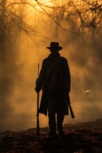Soldier Silhouette From The Civil War Era Period. Sunset In The Battlefield. Fiery Background. The Freedom War