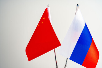 Wall Mural - Russian and Chinese flags on negotiation table