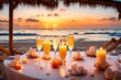 Romantic beach evening dinner during sunset: candles, champagne
