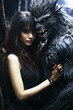 scary werewolf monster hugs beautiful girl in forest. The cover of the horror book of a romantic novel